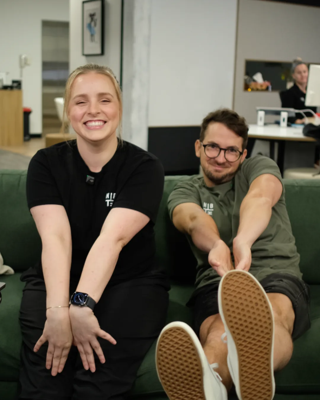 Two Neighbourhood team members on a couch